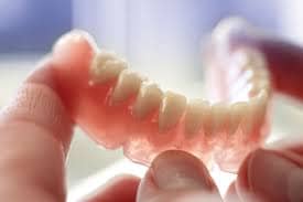 holding dentures